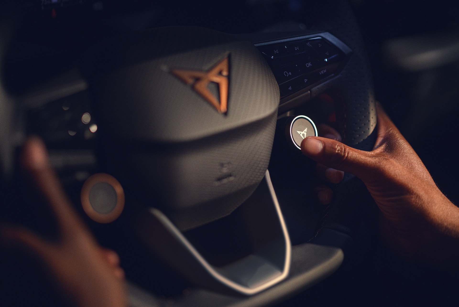 CUPRA Born interior view of the multifunctional steering wheel with satellite buttons